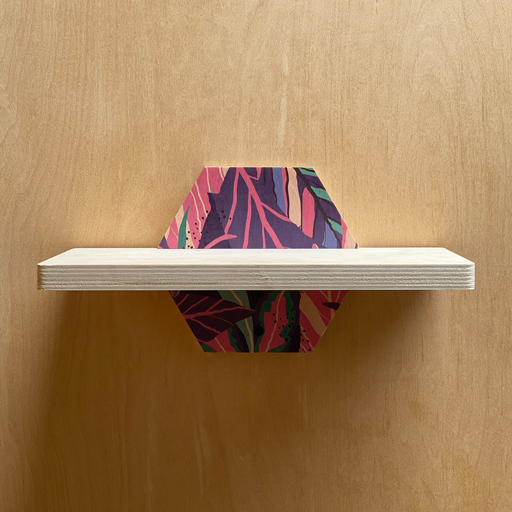 Hexagonal sturdy wall shelf with colorful leaf pattern for nature inspired interiors