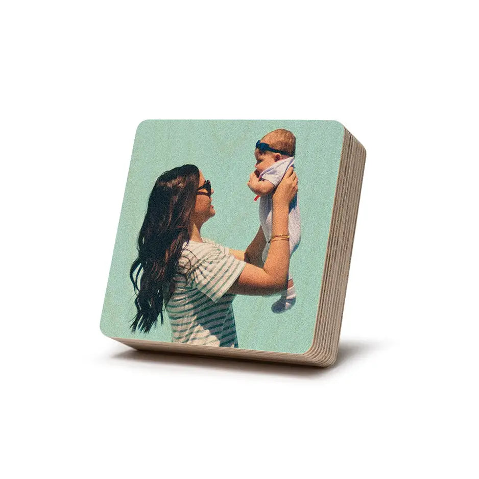 Wooden coaster featuring woman holding baby from Square Stash Box Print collection
