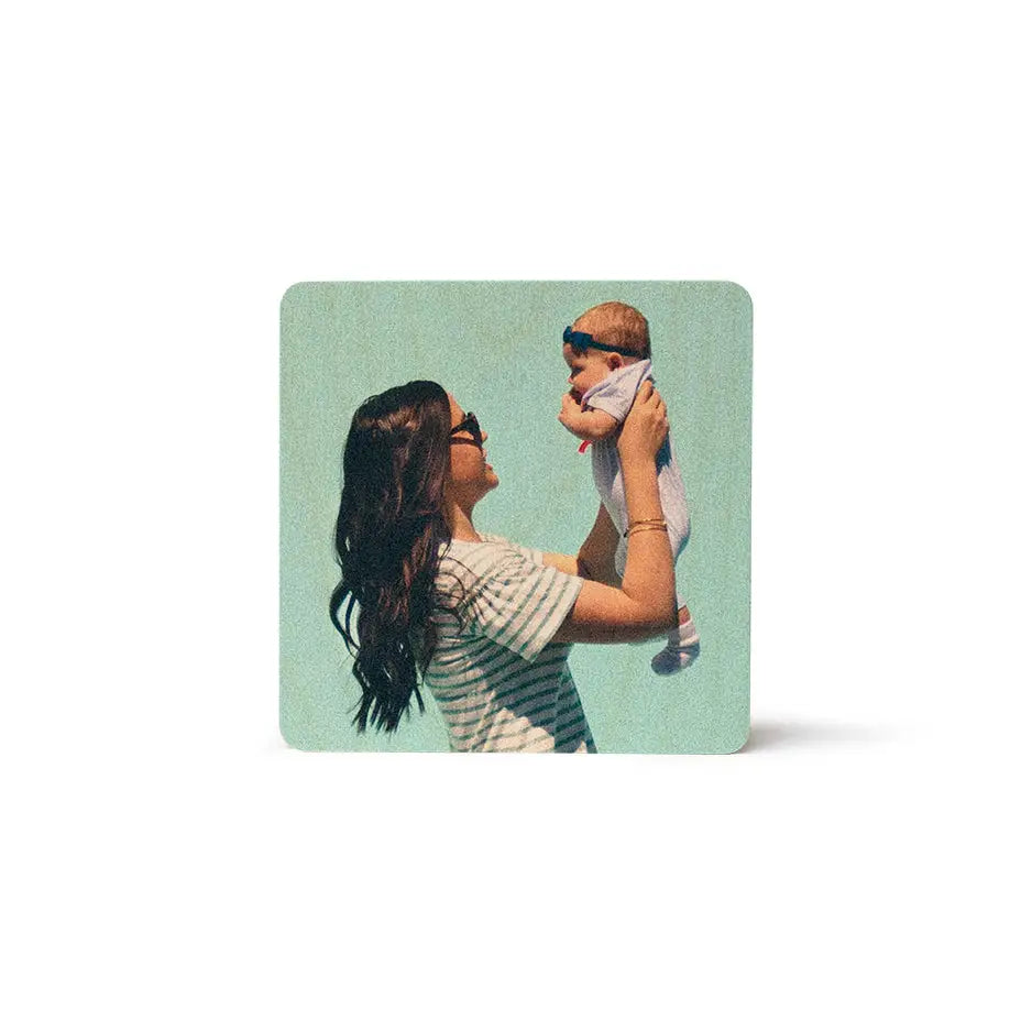 Woman holding a baby with a Square Stash Box Print design in the background