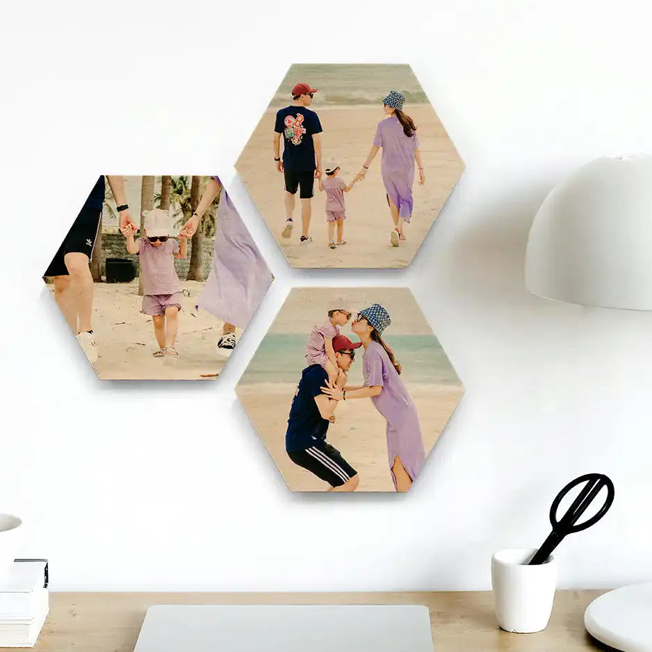 Three hexagonal photo prints mounted on a wall.