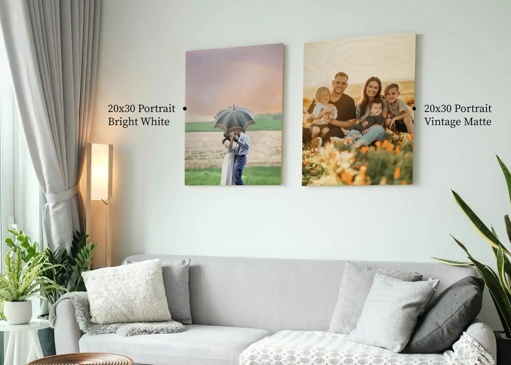 “Birch wood print above light gray couch with throw pillows and knitted blanket”