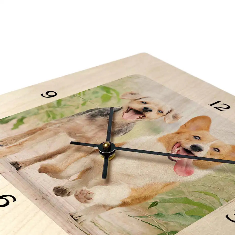 Wall clock featuring a watercolor painting of two playful dogs.